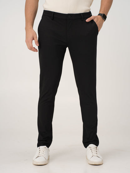 front view of black stretchable trousers by pant project, focusing on the tailored fit and sleek design