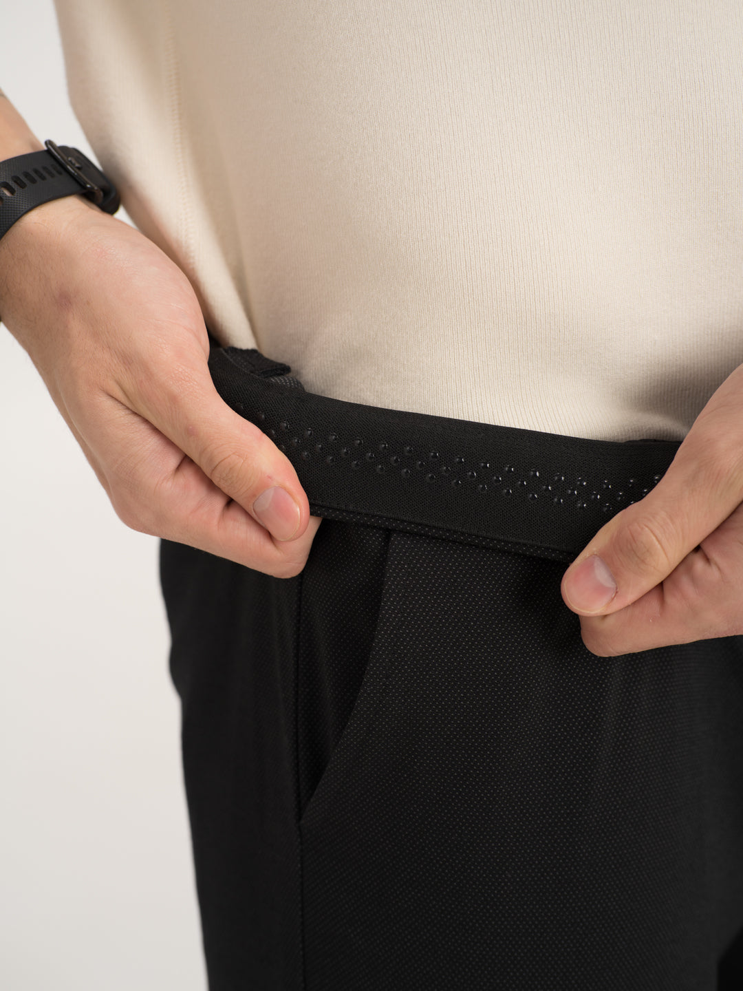 Close-up view of black stretchable trousers by pant project, focusing on the waistband detail