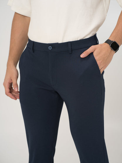 Full view of navy blue stretchable trousers by pant project, focusing on the tailored fit and sleek design