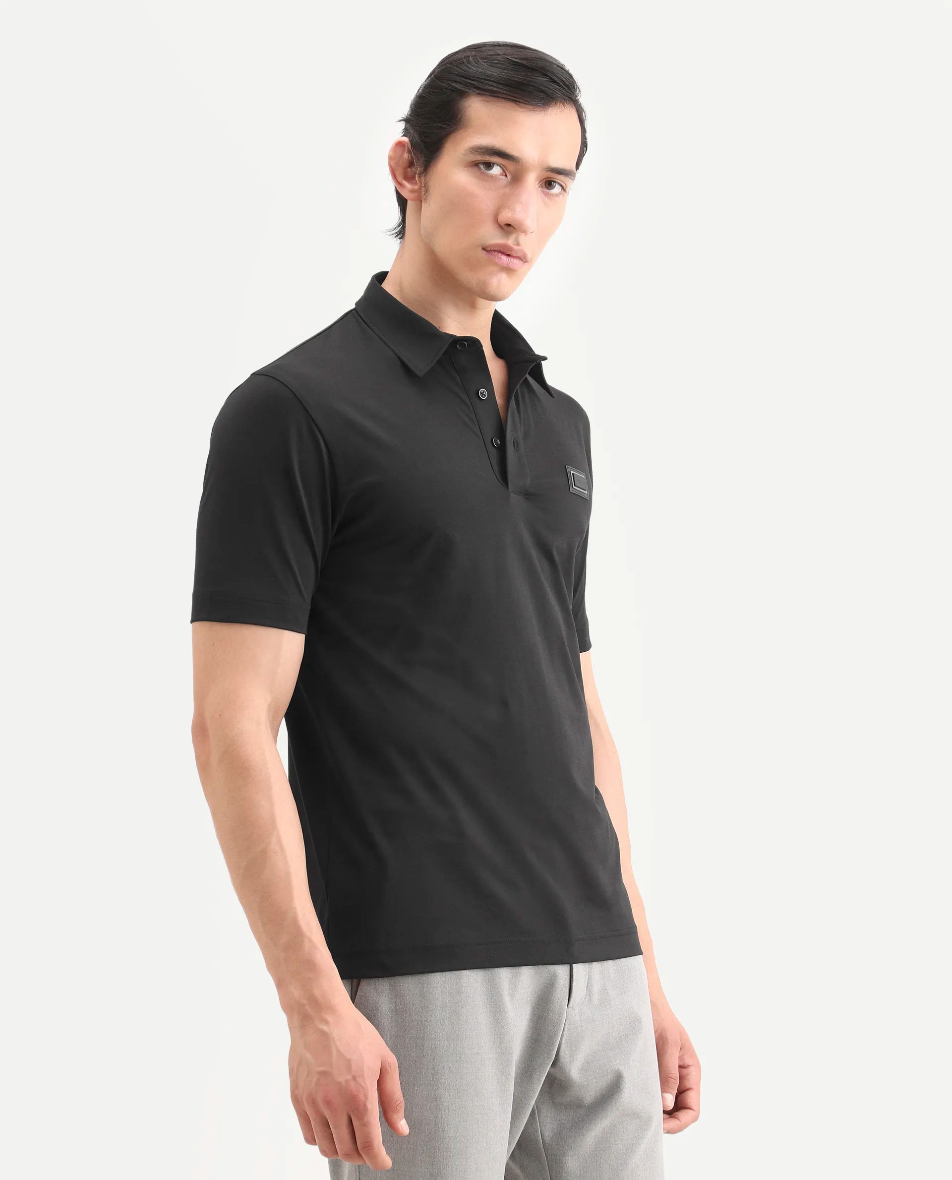 Rare Rabbit Men's Badger-S26 Black Cotton Blend Fabric Half Sleeve Spread Collar Regular Fit Plain Polo | Rare Rabbit at Broadway