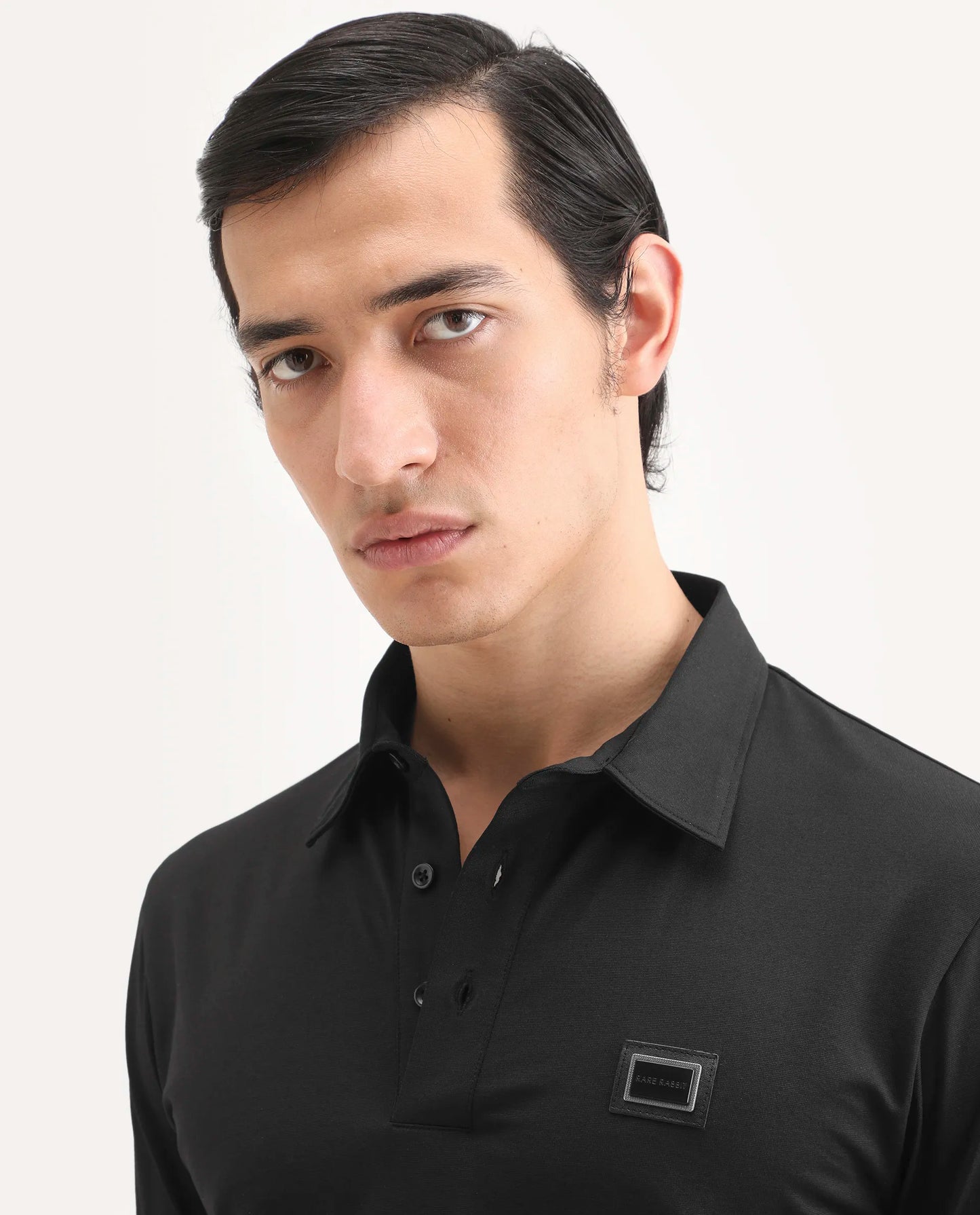Rare Rabbit Men's Badger-S26 Black Cotton Blend Fabric Half Sleeve Spread Collar Regular Fit Plain Polo | Rare Rabbit at Broadway