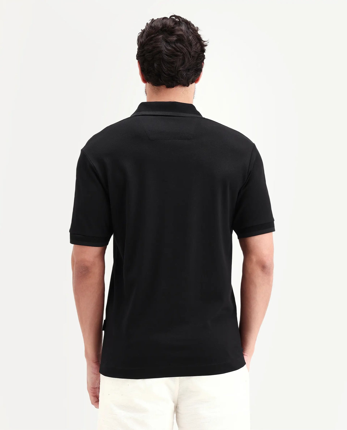 Rare Rabbit Men's Clak Black Cotton Blend Fabric Half Sleeve Spread Collar Regular Fit Plain Polo | Rare Rabbit at Broadway