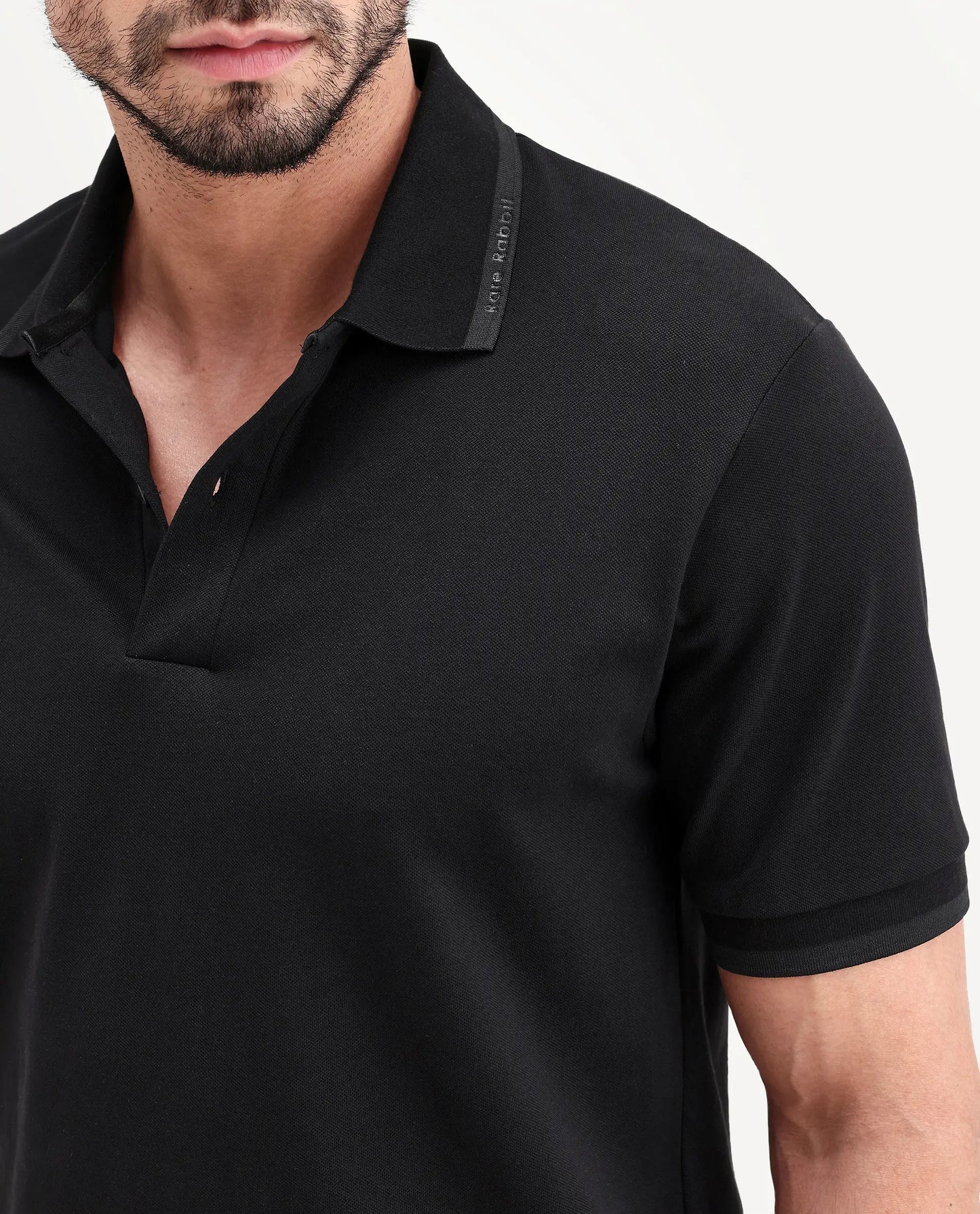 Rare Rabbit Men's Clak Black Cotton Blend Fabric Half Sleeve Spread Collar Regular Fit Plain Polo | Rare Rabbit at Broadway