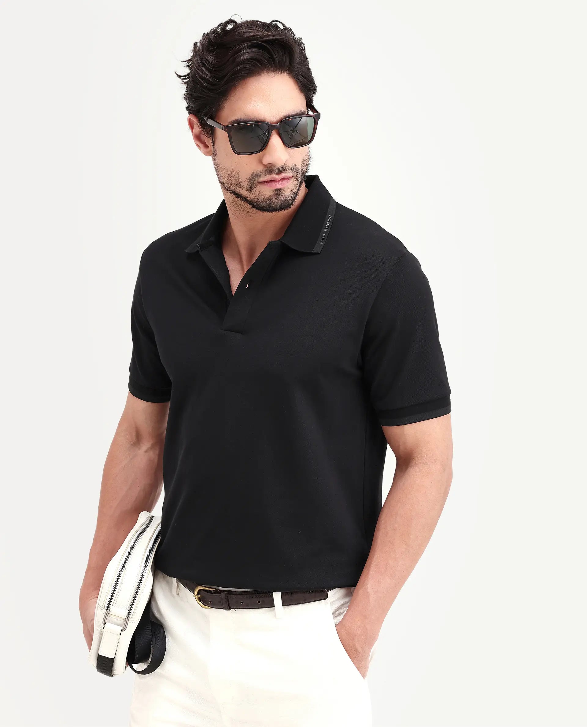 Rare Rabbit Men's Clak Black Cotton Blend Fabric Half Sleeve Spread Collar Regular Fit Plain Polo | Rare Rabbit at Broadway