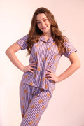 Woman posing stylishly in trendy and cozy Teddyboo print Pyjama Set night suit by NapStory