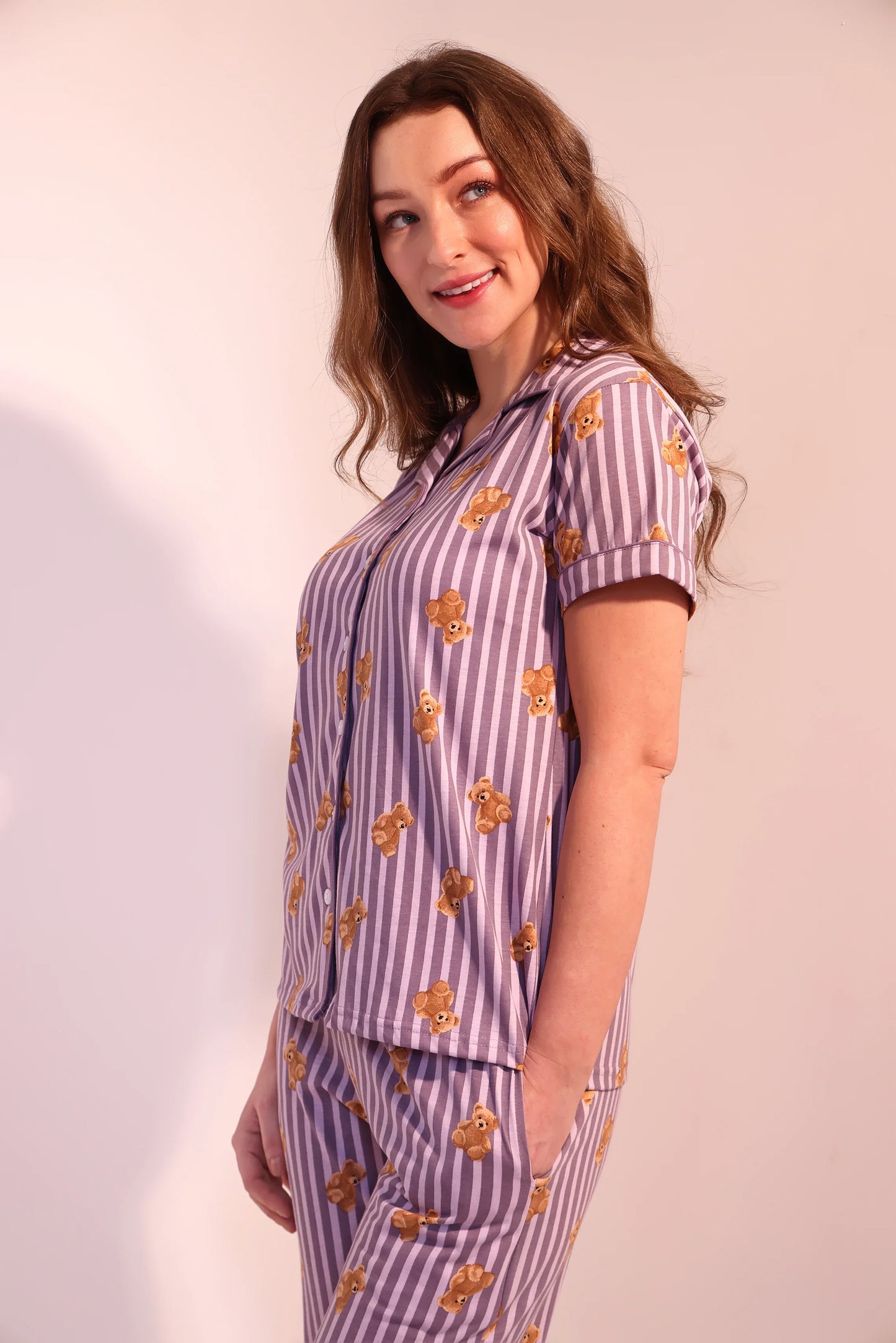 Side view of woman flaunting cute Teddyboo print Pyjama Set breathable 100% cotton nightwear by NapStory