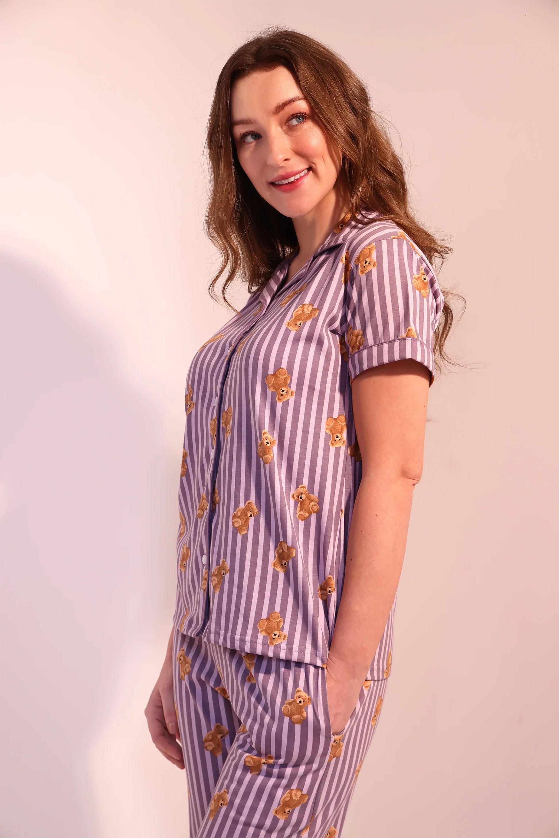 Side view of woman flaunting cute Teddyboo print Pyjama Set breathable 100% cotton nightwear by NapStory