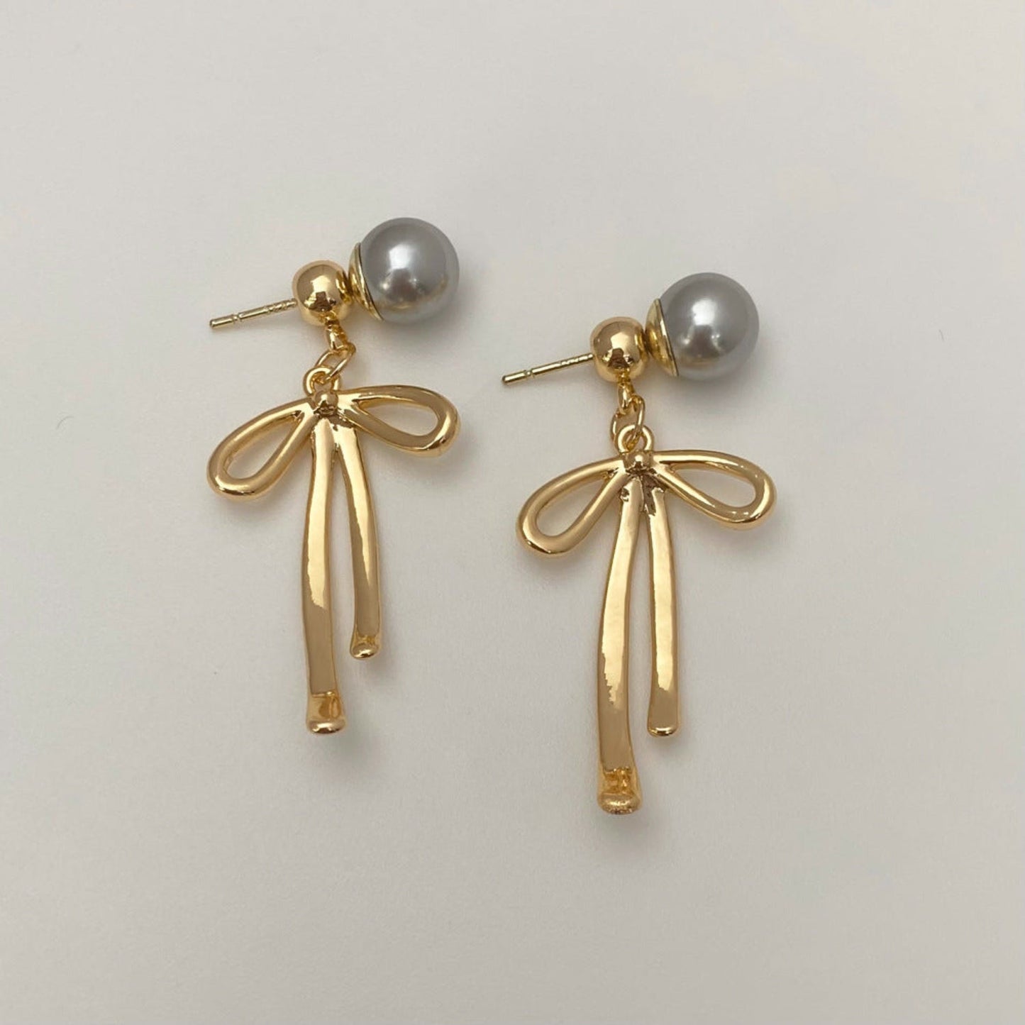 Elegant Dual Tone Bow Knot Dangles Earrings JLT13244 | Just Lil Things at Broadway